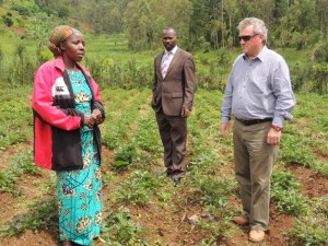 EU Ambassador and the Rulindo Vice Mayor talking to Margaret a farmer who has benefited from the OFSP project
