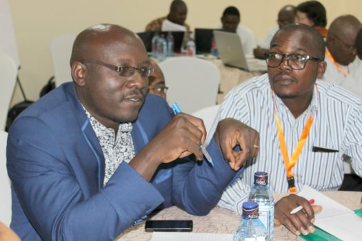 Ambilikile Mwenisongole and Eliya Kapalasa hold discussions about sustainable pre-basic seed production