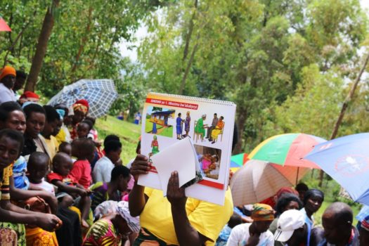 A community health volunteer during nutrition counseling session in Burera District
